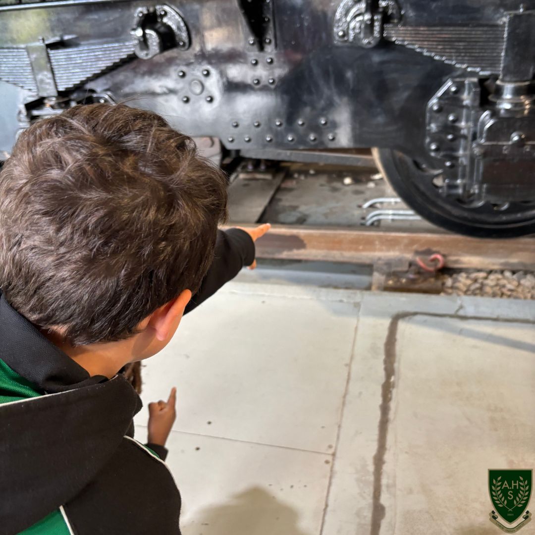 Young boy looking at a train