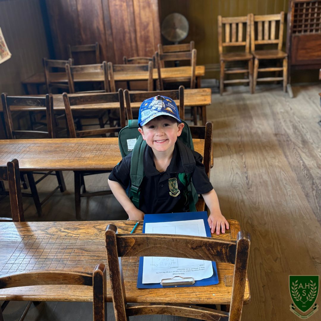 Young boy sitting at a desk