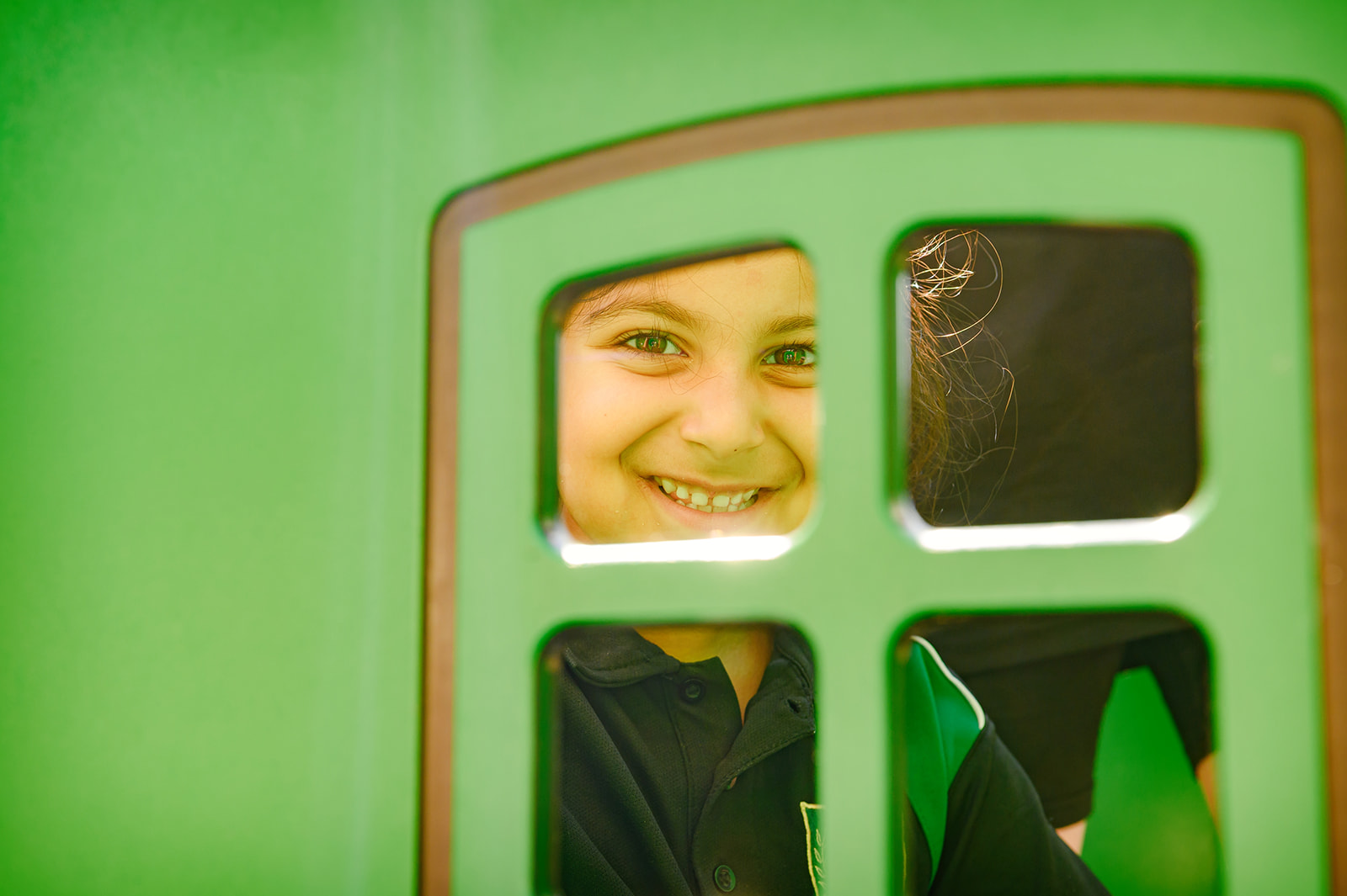 Young child on play equipment 