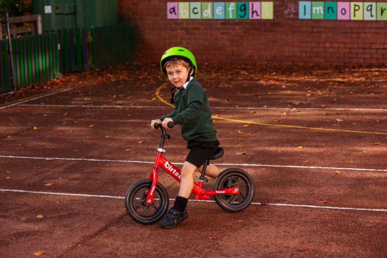 Young child on a balance bike